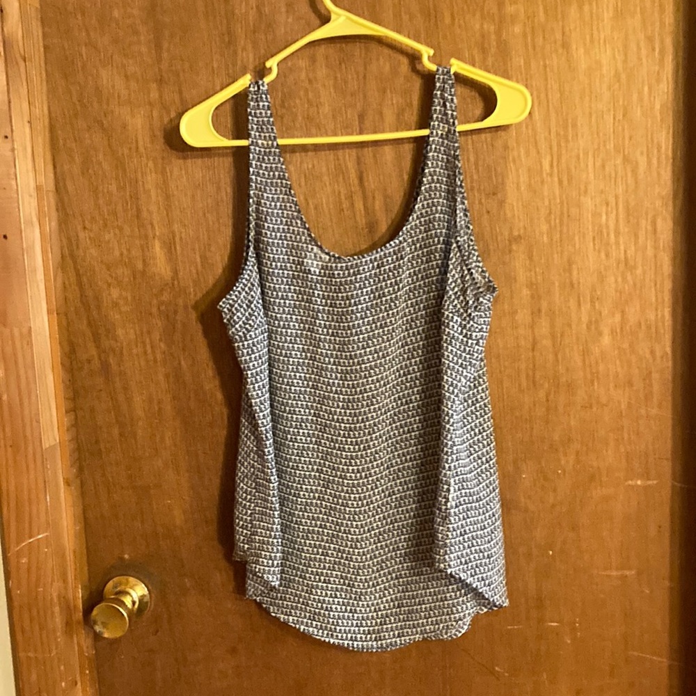 Very lt wt. shirt. Curved bottom of shirt. Long enough to cover hips.